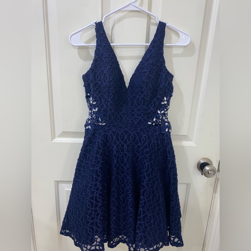 Navy blue homecoming dress with side cutout, low back.